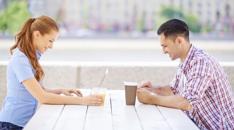 Couple using social media on a date